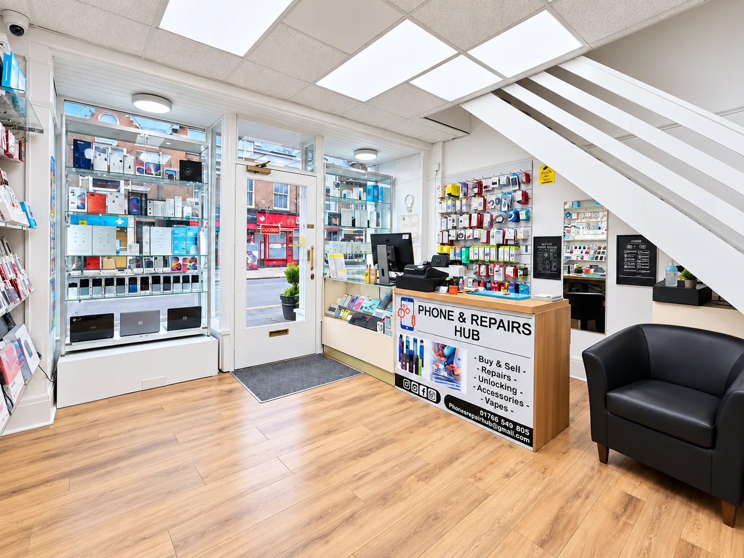 Interior of Phones & Repair Hub showing the entrance, service counter and product displays