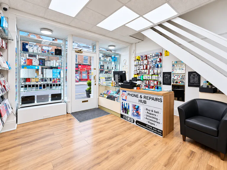 Interior of Phones & Repair Hub with the service counter and product displays
